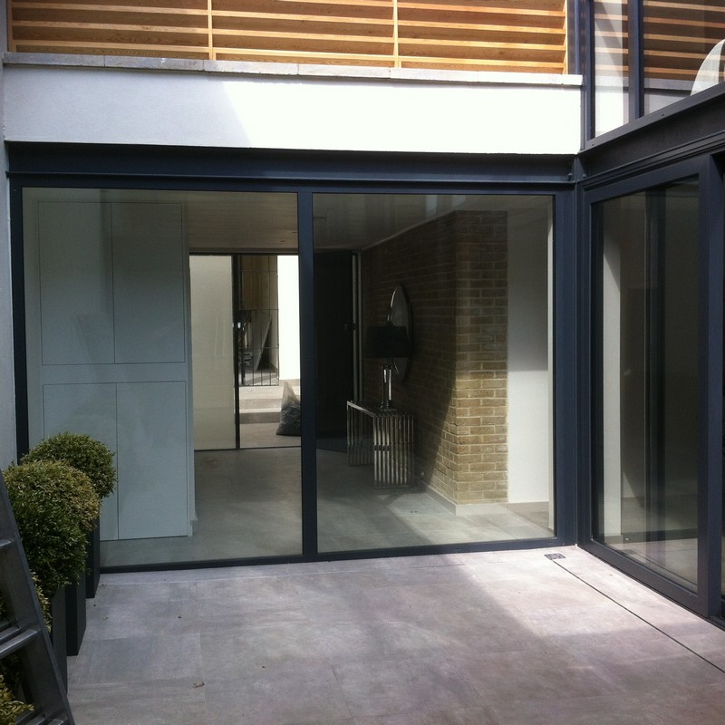Floor-to-ceiling sliding doors opening to courtyard in Paddington