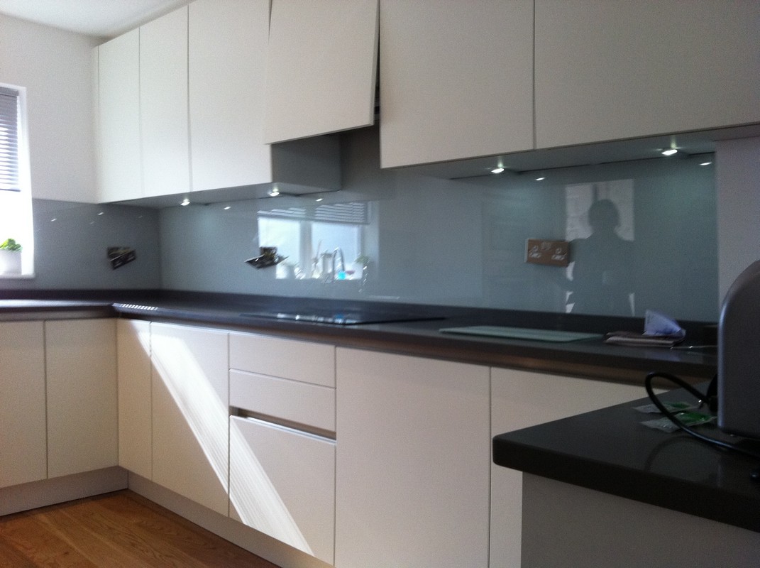 Grey glass kitchen splashback with LED lighting in Paddington