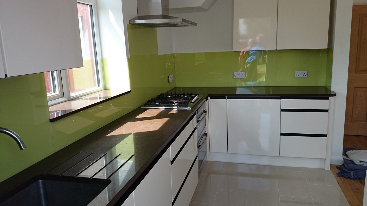 Lime green glass kitchen splashback installed by Paddington glaziers
