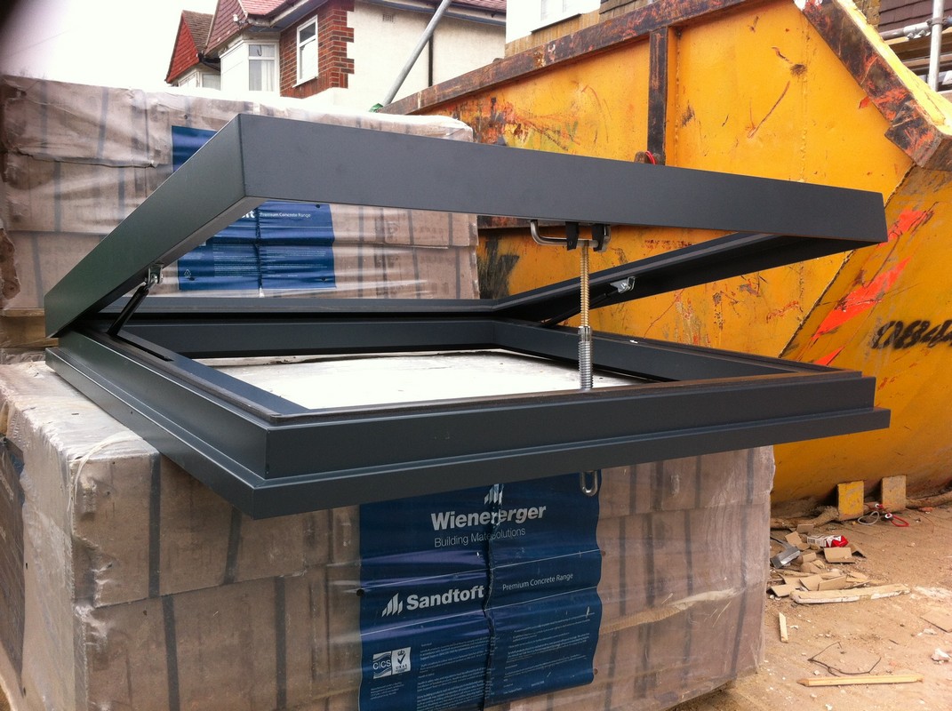 Opening flat roof skylight in anthracite grey installed in Paddington
